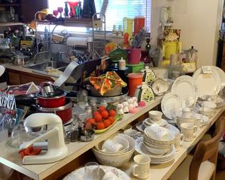 Large set of French Arcopal dinnerware, vintage juicer, vintage kitchen aid mixer, vintage sugar and flour canisters, vintage colorful Tupperware, vintage ruby red Avon glasses