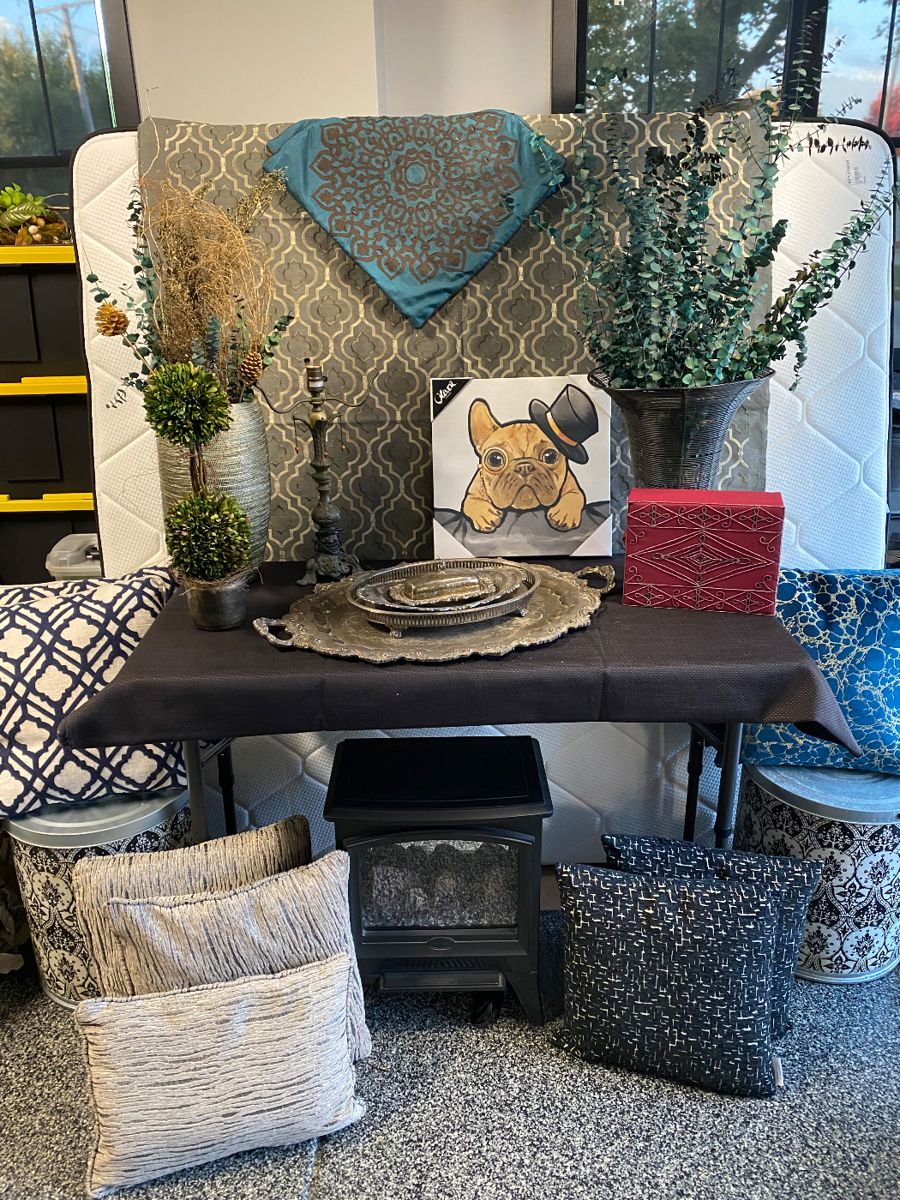 Vases, florals, pillows, silver trays, artwork, plug-in fireplace, decorative box