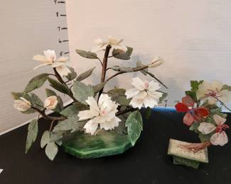 Glass flowers on stone bases