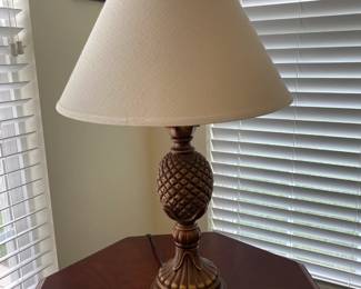 2 copper colored pineapple base lamps with shades