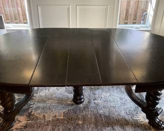Vintage Walnut Finish 54" Round Jacobean Style Dining Table with Barely Twist Legs and Claw Feet. Extends to 93" with 4 Leaves. 29" H with 4" Apron. Photo 2 of 9.