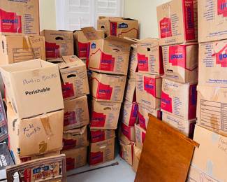 boxes full of books, dvds, vcr tapes, etc