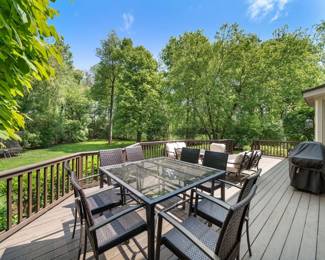 Fantastic Glass Top Table w/ 8 Chairs    A seating set, and Weber Grill  