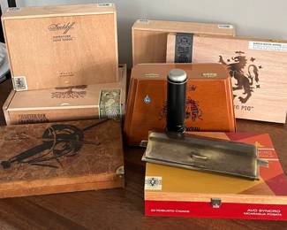 Wooden cigar boxes and a few cigars 
