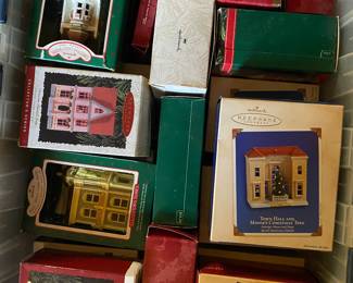 Boxes and boxes of Hallmark village ornaments.