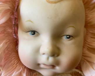 Okay, there is at least one creepy doll and it is probably this one of Vladimir Putin as an infant.