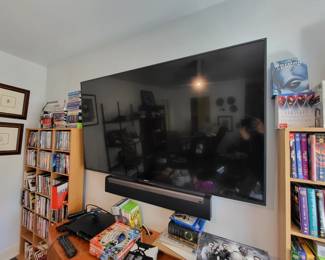 One of several 65inch televisions and a huge selection of video games and box set dvds including game of thrones and star trek