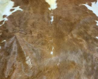 Huge cow hide rug.