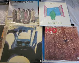 genesis , Hall and Oats , Foreigner , and Peter Gabriel vinyl records.