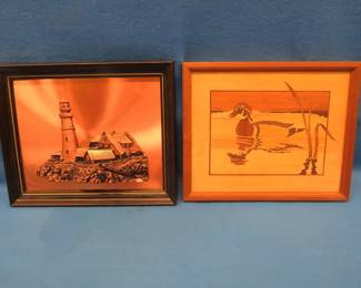 Lot 122. Framed copper lighthouse and a framed wood cut duck.&nbsp; Both measure 16" x 13"