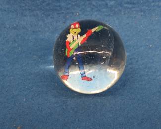 Lot 160. Clear marble with figure.&nbsp; 1 1/4" in diameter.