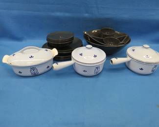 Lot 37. Black dish set and a 3-piece enameled cast iron cookware set from Holland
