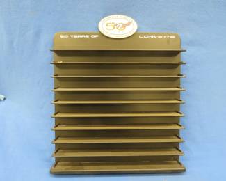 Lot 303. 23" x 28" 50 Years of Corvette die-cast display shelf