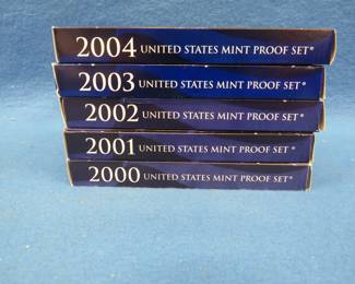 Lot 321. Five US Mint sets.&nbsp; Each set contains regular circulation coins and a set of that year's state quarter issues.