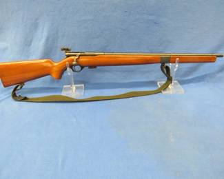 Lot 12. Mossberg model 42M-C bolt-action 22 rifle.&nbsp; S-L-LR.&nbsp; Includes magazine, sling, Mossberg S-130 peep sight, and scope rail.&nbsp; Front sight is missing.