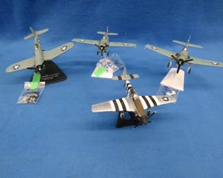 Lot 271. Four WW2-era die-cast planes with stands.&nbsp; 1:72 scale.