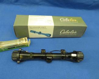 Lot 34. Pine Ridge and a Tasco scopes and a game call