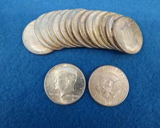 Lot 324. Sixteen 1964 Kennedy half dollars.&nbsp; 90% silver.