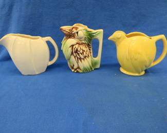 Lot 344. Two marked McCoy and one unmarked pitcher.&nbsp; All in very good condition.