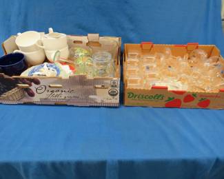 Lot 341. Two flats of glassware including stemware, soup mugs, plates, and more