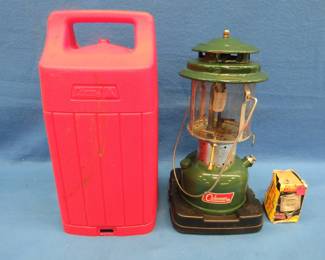 Lot 305. 1971 Coleman double-mantle lantern with a Coleman carrying case.&nbsp; Includes two sparkers and a funnel.
