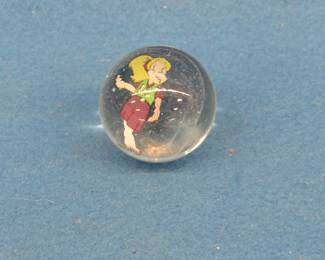 Lot 313. Shooter size marble with cartoon figure insert