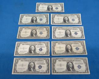 Lot 219. Nine circulated $1.00 silver certificates from 1935