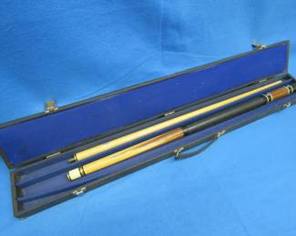 Lot 50. Two-piece pool cue and case. Needs a tip