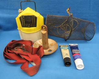Lot 118. Minnow trap and bucket, boat strap, anchor, and two unopened marine lubricants