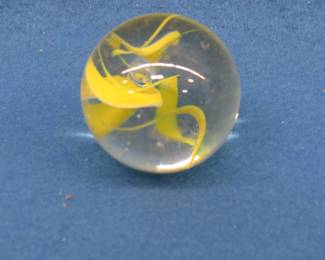 Lot 158. Large marble with a yellow swirl.&nbsp; 1 1/2" in diameter.