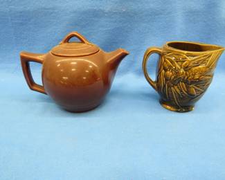 Lot 351. McCoy teapot in very good condition and an unmarked small pitcher with a small chip on the base