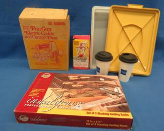 Lot 332. Cookie press, Tupperware cake transporter, baking rack, and more