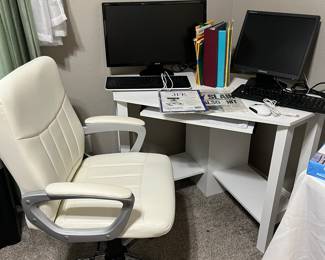 white office chair and desk, keyboards and monitors