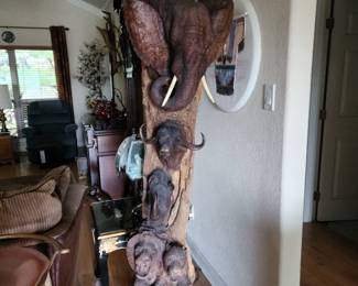"Big 5" totem carved from ironwood.  Approximately 4' tall,.