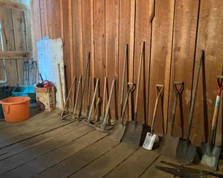 Hand tools , saws , muck bucket , wheel barrow, leaf blower etc 