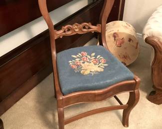One of two vintage parlor chairs