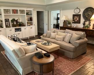 Two sofas; décor; coffee table; round side table