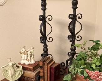 Old books; tall candleholders
