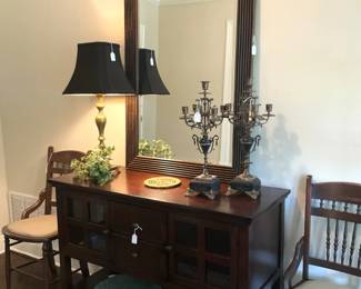 Buffet/entry/sofa table; large mirror; lamp; candelabras; antique chairs