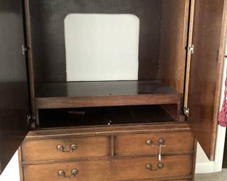 Antique linen press converted to an entertainment center