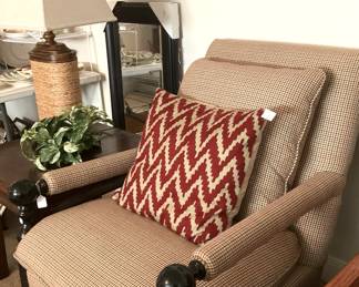 Upholstered arm chair; good-looking textured lamp