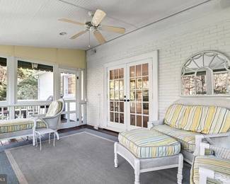Room view - Lloyd Flanders Heirloom Collection wicker furniture with Sunbrella slipcover fabric outdoor
cushions 