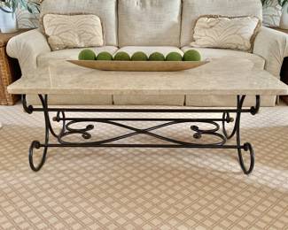 $525 - Marble top coffee table on scroll wrought iron base with gilt accents - 18" H, 48" L, 25" W