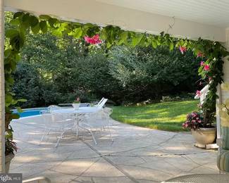 $375 - Woodard wrought iron, Briarwood pattern table and chairs