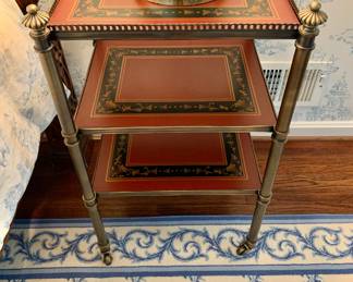$275 - Scully & Scully 3-tiered brass and red leather end table on brass casters - 30" H, 18" W, 16" D