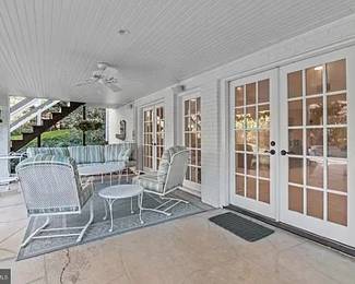 Wrought iron patio set - Fullerton Collection wrought iron with Sunbrella outdoor cushions - $495 - Pair of chairs; $50 - Small table - $595- Sofa