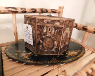 18th Century Quillwork tea caddy.  Ladies of this period would buy the custom made tea box, take it home then with their fingers roll and cut paper to affix to the boxes surface, the oval might contain a small water color.  Rare to find, this one has some losses but is for the most part intact. $1,200.00