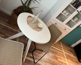 West Elm table and wicker chairs