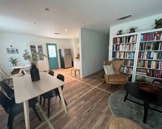Living room and dining area full of WEST ELM and IKEA furniture