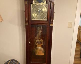 Howard Miller grandfather clock. Not sure if it runs or not.